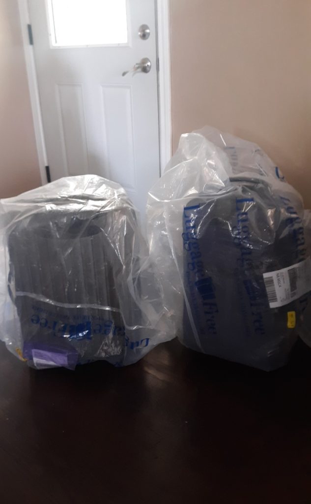shipped luggage wrapped in luggage free plastic bags
