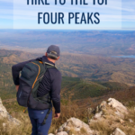 Hiker looking over Four Peaks